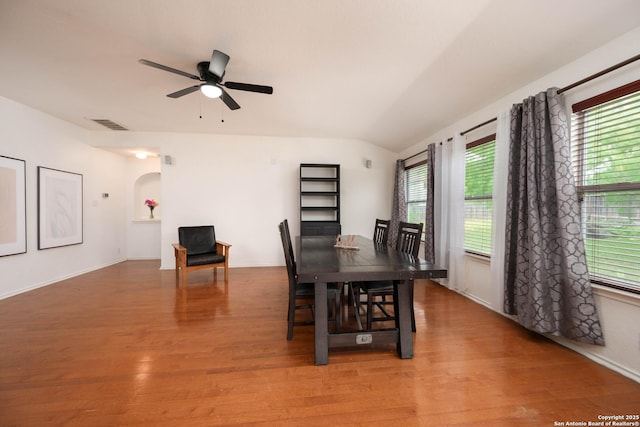 4706 Granite Shls, San Antonio, TX 78244 - dining area with light wood-style flooring, arched walkways, ceiling fan, vaulted ceiling, and baseboards