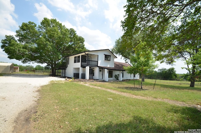3160 Weil, Marion, TX 78124 - view of front of house with a balcony, driveway, and stucco siding
