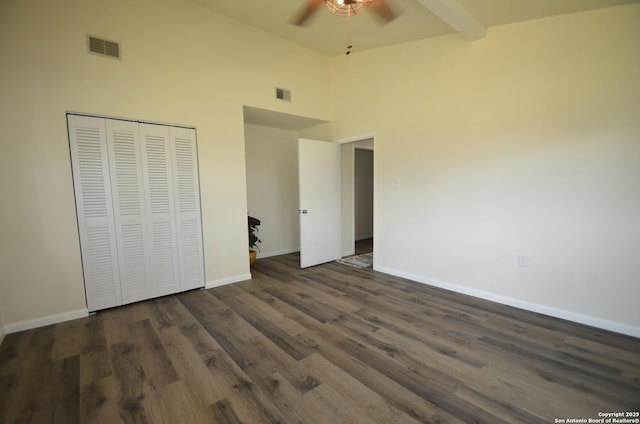 3160 Weil, Marion, TX 78124 - unfurnished bedroom with high vaulted ceiling, baseboards, dark wood-type flooring, a closet, and ceiling fan