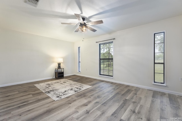 3160 Weil, Marion, TX 78124 - spare room with wood finished floors, a ceiling fan, and baseboards