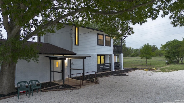 3160 Weil, Marion, TX 78124 - view of front facade featuring brick siding and a balcony