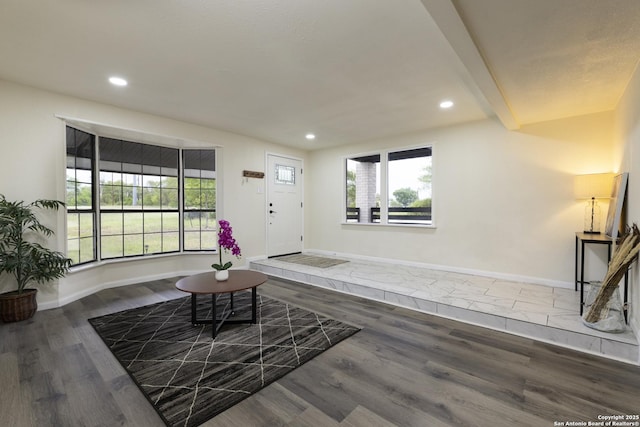 3160 Weil, Marion, TX 78124 - unfurnished living room featuring recessed lighting, baseboards, wood finished floors, and beam ceiling