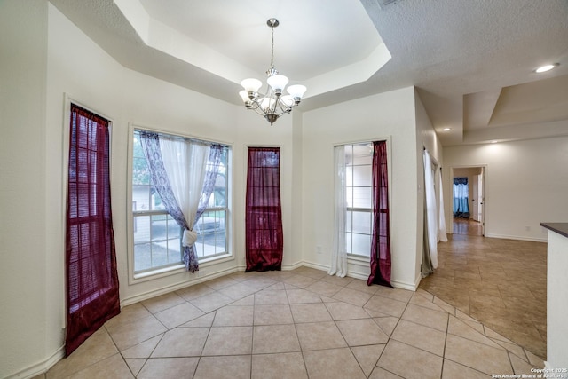 3343 Dove Park Ln, San Antonio, TX 78253 - foyer featuring a tray ceiling, a chandelier, and light tile patterned flooring