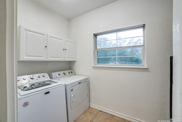 3343 Dove Park Ln, San Antonio, TX 78253 - washroom featuring cabinet space, washer and dryer, baseboards, and light tile patterned floors