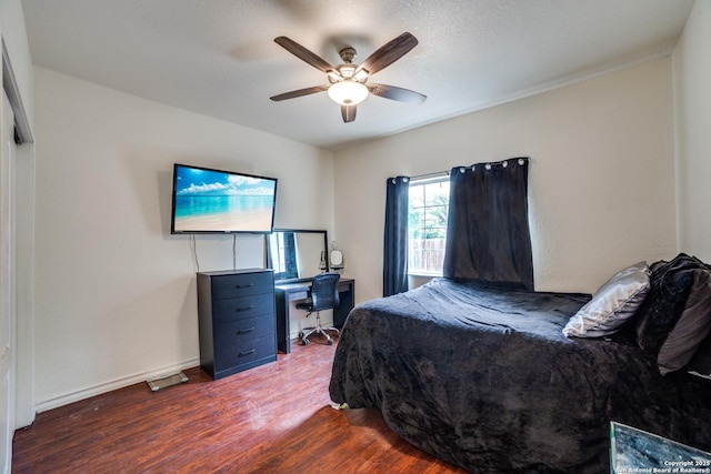 3343 Dove Park Ln, San Antonio, TX 78253 - bedroom featuring dark wood-type flooring, a ceiling fan, baseboards, and a desk