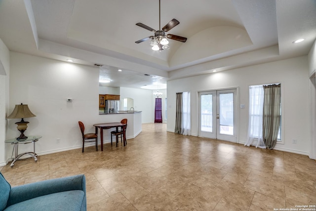 3343 Dove Park Ln, San Antonio, TX 78253 - living room with ceiling fan, a raised ceiling, a chandelier, recessed lighting, and baseboards