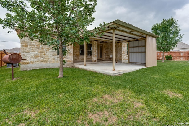 712 Crestview, Floresville, TX 78114 - rear view of property with a patio area and stone siding