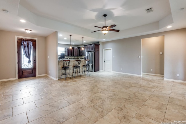 712 Crestview, Floresville, TX 78114 - living area with recessed lighting, a raised ceiling, ceiling fan, and baseboards