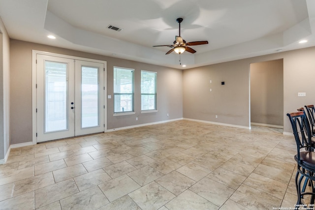 712 Crestview, Floresville, TX 78114 - spare room featuring french doors, a raised ceiling, a ceiling fan, recessed lighting, and baseboards