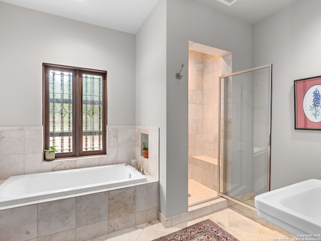 2835 Palomino Spgs, Bandera, TX 78003 - bathroom with a stall shower, a garden tub, and tile patterned flooring