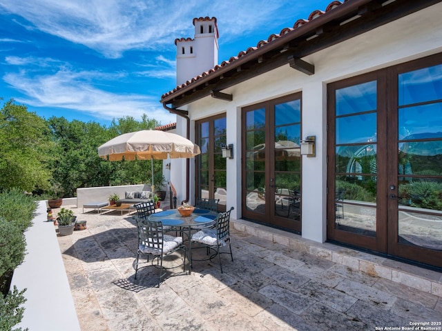 2835 Palomino Spgs, Bandera, TX 78003 - view of patio with french doors and an outdoor hangout area