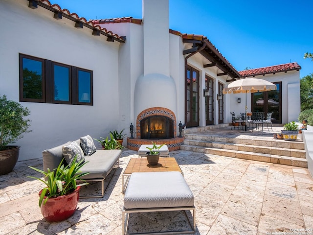 2835 Palomino Spgs, Bandera, TX 78003 - view of patio / terrace featuring an outdoor brick fireplace