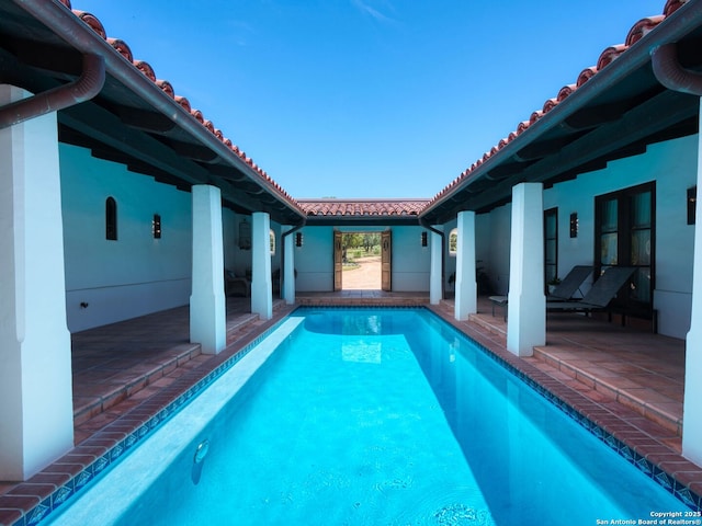 2835 Palomino Spgs, Bandera, TX 78003 - outdoor pool featuring a patio area