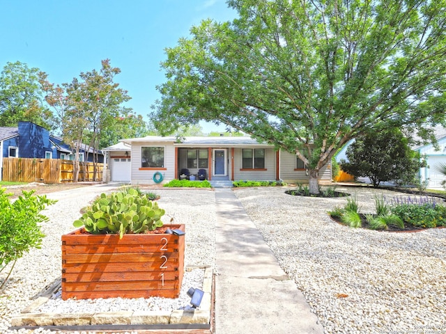 221 Harmon, San Antonio, TX 78209 - view of front facade featuring an attached garage and a porch