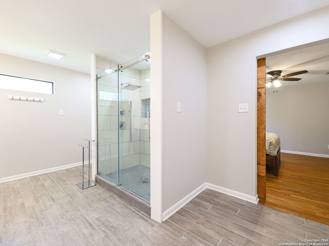 221 Harmon, San Antonio, TX 78209 - full bathroom with wood finished floors, a stall shower, ensuite bath, ceiling fan, and baseboards