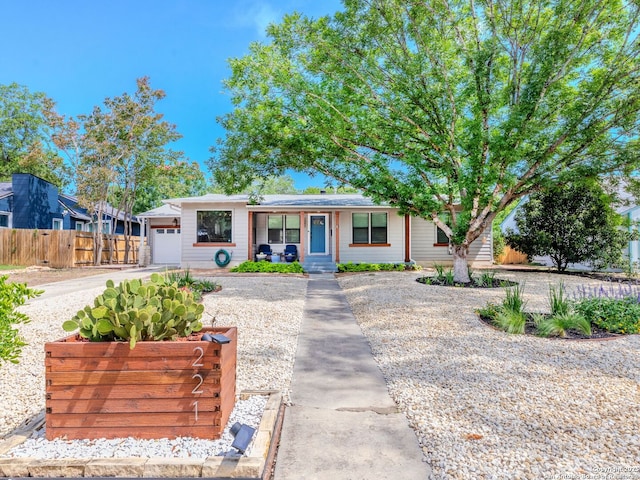 221 Harmon, San Antonio, TX 78209 - view of front facade featuring an attached garage and covered porch