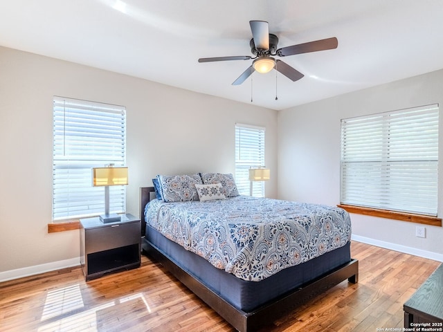 221 Harmon, San Antonio, TX 78209 - bedroom with light wood-type flooring, baseboards, and a ceiling fan
