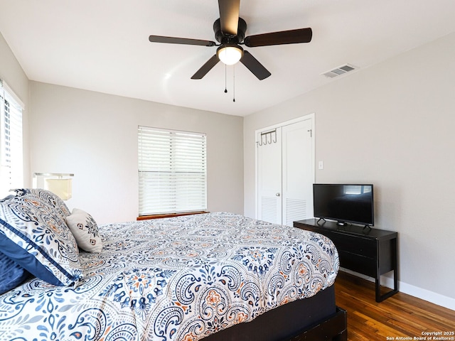 221 Harmon, San Antonio, TX 78209 - bedroom featuring wood finished floors, a closet, baseboards, and ceiling fan