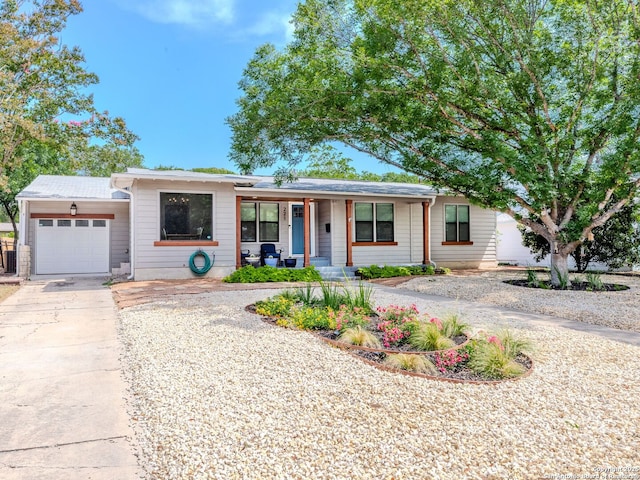 221 Harmon, San Antonio, TX 78209 - ranch-style home featuring a garage, covered porch, and driveway