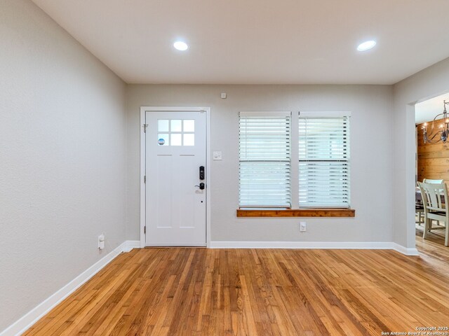 221 Harmon, San Antonio, TX 78209 - entrance foyer with a chandelier, light wood-type flooring, baseboards, and recessed lighting