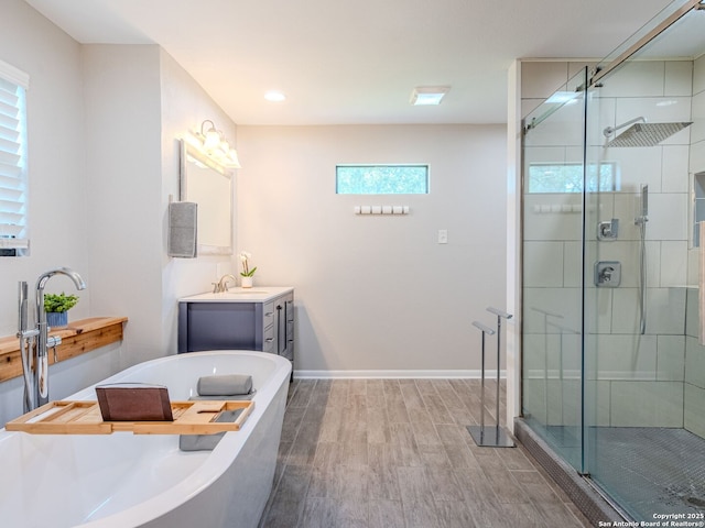 221 Harmon, San Antonio, TX 78209 - full bath with vanity, a stall shower, a bath, and wood finished floors