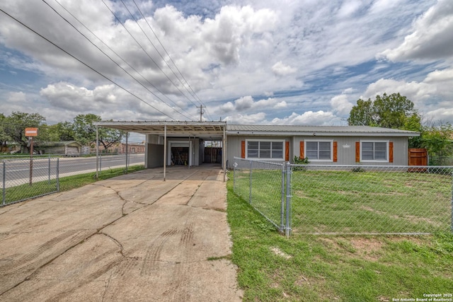 803 E Edwards, Crystal City, TX 78839 - view of front of property featuring a carport, driveway, and metal roof