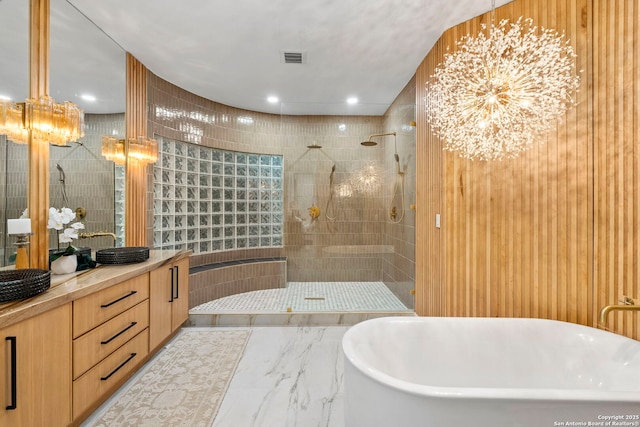 6 Turin Ct, San Antonio, TX 78257 - bathroom featuring a freestanding tub, walk in shower, vanity, marble finish flooring, and a chandelier