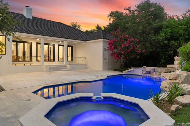 6 Turin Ct, San Antonio, TX 78257 - outdoor pool featuring an in-ground hot tub, a patio, and french doors