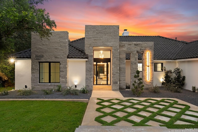 6 Turin Ct, San Antonio, TX 78257 - modern home with stone siding, a tile roof, stucco siding, and a front yard