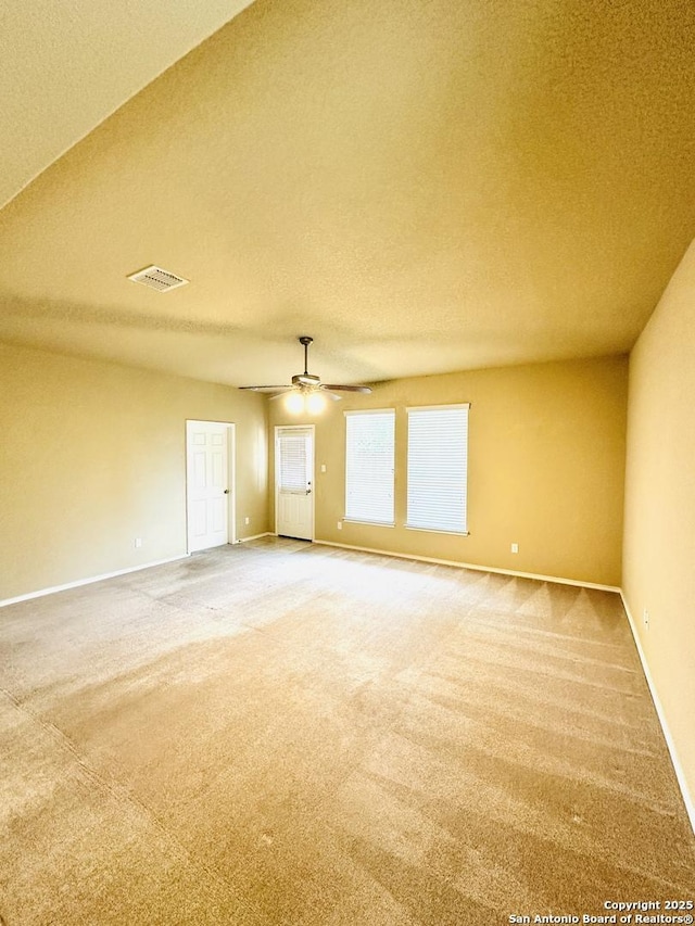 4602 Todds Farm, San Antonio, TX 78244 - spare room with carpet flooring, baseboards, a ceiling fan, and a textured ceiling