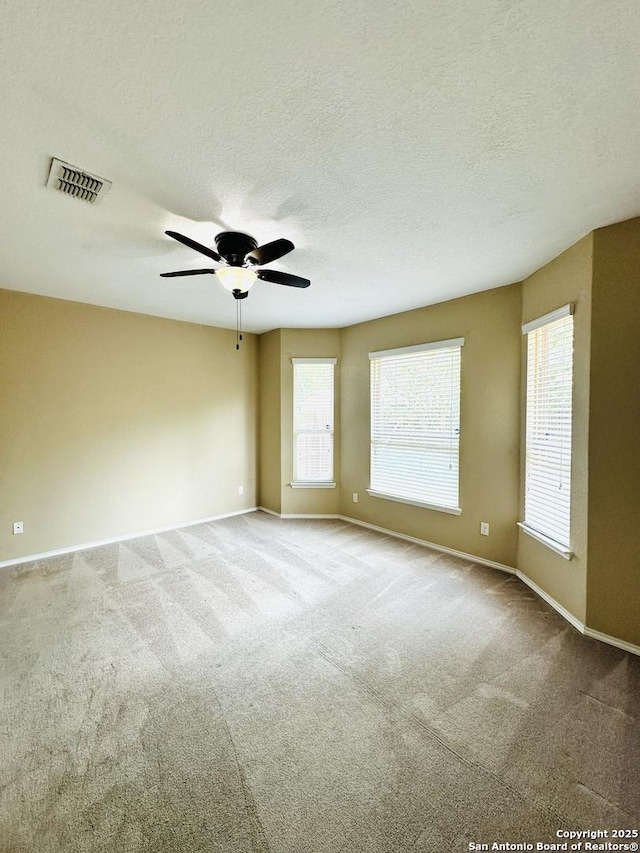 4602 Todds Farm, San Antonio, TX 78244 - unfurnished room featuring carpet floors, baseboards, ceiling fan, and a textured ceiling