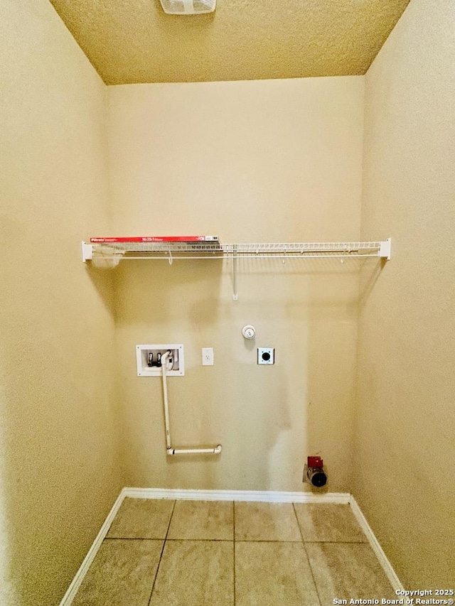 4602 Todds Farm, San Antonio, TX 78244 - laundry room with hookup for an electric dryer, baseboards, hookup for a washing machine, and tile patterned flooring