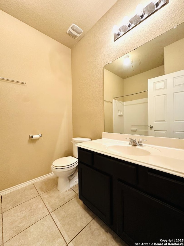4602 Todds Farm, San Antonio, TX 78244 - full bath with toilet, vanity, tile patterned flooring, baseboards, and a textured ceiling