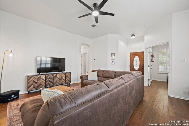 788 San Luis, New Braunfels, TX 78132 - living room featuring arched walkways, ceiling fan, dark wood-type flooring, and baseboards