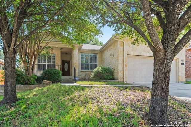 788 San Luis, New Braunfels, TX 78132 - ranch-style home with a garage, stone siding, and driveway