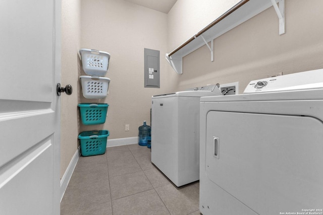 11926 Tower Crk, San Antonio, TX 78253 - washroom featuring washer and clothes dryer, electric panel, light tile patterned flooring, and baseboards