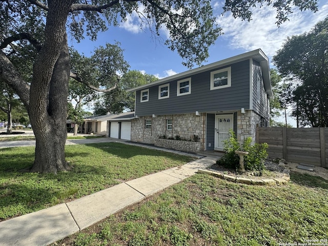 430 Indigo, San Antonio, TX 78216 - colonial inspired home with stone siding, concrete driveway, and an attached garage