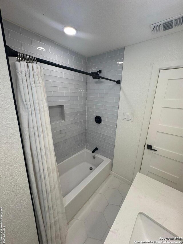 430 Indigo, San Antonio, TX 78216 - full bath featuring tile patterned flooring, shower / tub combo, and a textured wall