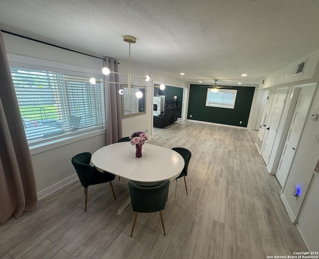 430 Indigo, San Antonio, TX 78216 - dining space with a textured ceiling, a ceiling fan, light wood-style floors, baseboards, and recessed lighting