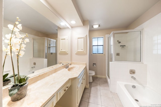 5359 Fredericksburg Unit 513, San Antonio, TX 78229 - full bathroom featuring toilet, double vanity, a stall shower, tile patterned floors, and a garden tub