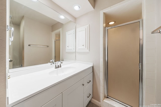 5359 Fredericksburg Unit 513, San Antonio, TX 78229 - bathroom with a shower stall, vanity, and recessed lighting