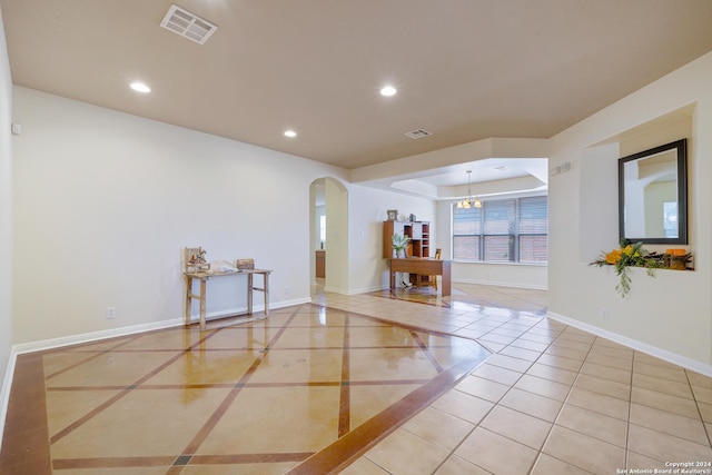 1711 Mountain, San Antonio, TX 78258 - tiled spare room with arched walkways, inlaid floor details, recessed lighting, baseboards, and a chandelier