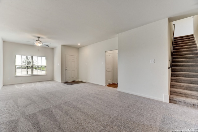 3139 Jackson Smt, Converse, TX 78109 - unfurnished living room with ceiling fan, carpet flooring, and stairs