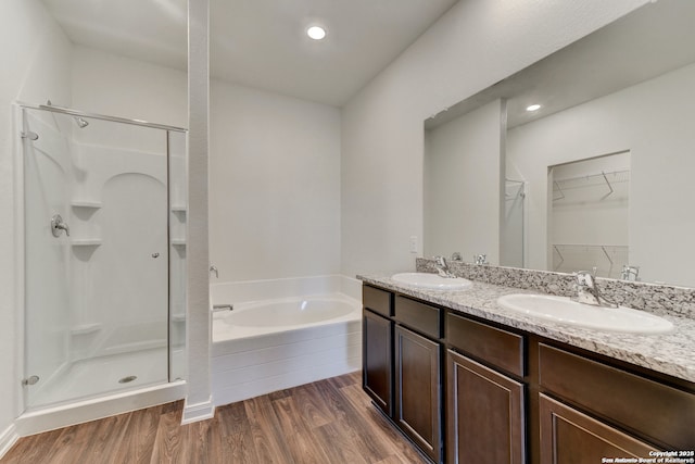 3139 Jackson Smt, Converse, TX 78109 - full bath with a stall shower, a bath, wood finished floors, double vanity, and a walk in closet