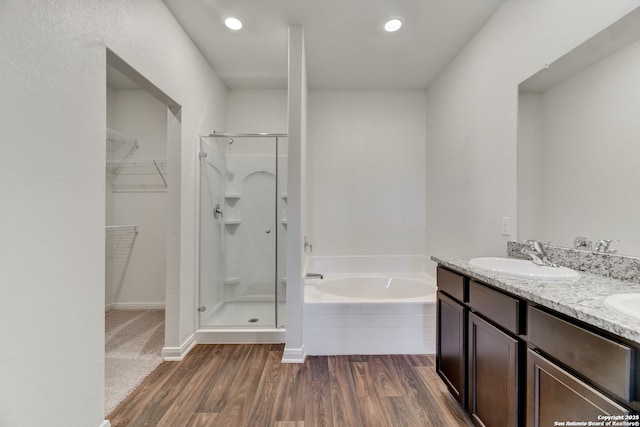 3139 Jackson Smt, Converse, TX 78109 - full bath with a stall shower, wood finished floors, a garden tub, a walk in closet, and recessed lighting