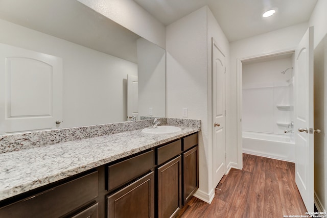 3139 Jackson Smt, Converse, TX 78109 - bathroom with wood finished floors, vanity, and bathing tub / shower combination
