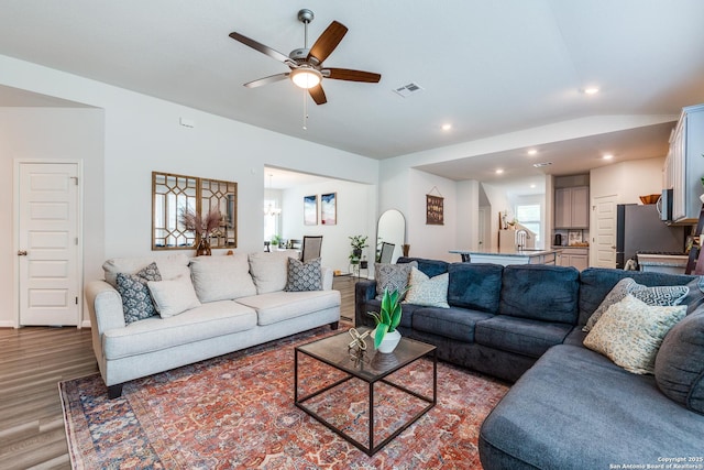12918 Lilly Pass, San Antonio, TX 78254 - living area with wood finished floors, a ceiling fan, recessed lighting, plenty of natural light, and vaulted ceiling