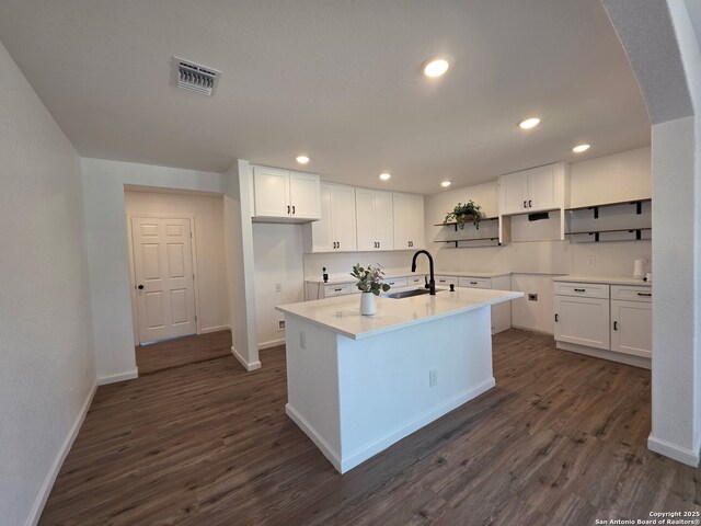 124 Baylor, San Antonio, TX 78204 - kitchen with a sink, open shelves, baseboards, dark wood finished floors, and recessed lighting
