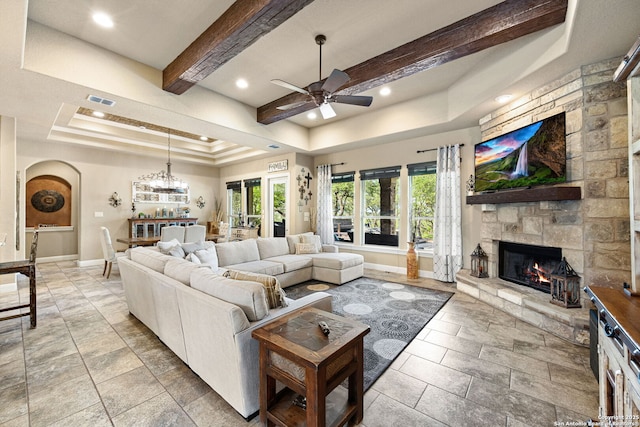 136 Eagle Crst, Spring Branch, TX 78070 - living area with a raised ceiling, ceiling fan, a stone fireplace, baseboards, and recessed lighting
