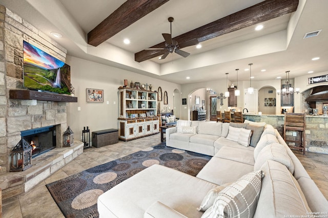 136 Eagle Crst, Spring Branch, TX 78070 - living area with ceiling fan, arched walkways, recessed lighting, a fireplace, and beamed ceiling